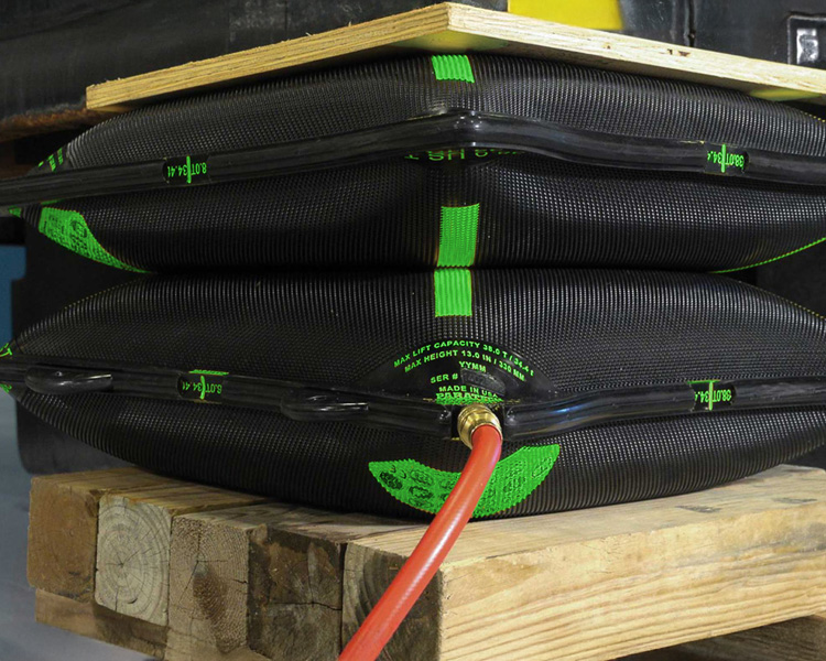 Two Simplex airbags inflated and ready to lift heavy loads.